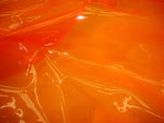 Load image into Gallery viewer, Orange 10 Gauge Transparent Tinted Plastic Vinyl Tinted 54 Inch Wide Fabric 10 Yard roll
