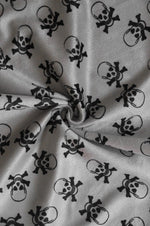 Load image into Gallery viewer, 58"  Wide Black skull on gray Velboa Fabric per yard
