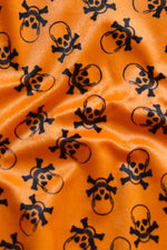 Load image into Gallery viewer, 58"  Wide Black skull on orange Velboa Fabric per yard
