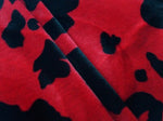 Load image into Gallery viewer, Cow Animal print Velboa Black on Red Spots Fabric BY THE YARD 60" Wide
