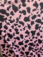 Load image into Gallery viewer, Black Cow on pink 4 way stretch spandex fabric 60 inches wide
