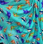 Load image into Gallery viewer, Turquoise stretch spandex with sea fish  fabric SOLD BY YARD 60 inches wide
