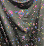 Load image into Gallery viewer, Multi stars and moon on black stretch Spandex Fabric  sold by yard
