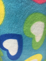 Load image into Gallery viewer, Fleece multi heart on blue  fabric by the yard
