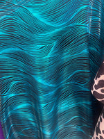 Load image into Gallery viewer, Turquoise waves on black Nylon Spandex print fabric.
