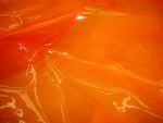 Load image into Gallery viewer, Orange 10 Gauge Transparent Tinted Plastic Vinyl Tinted 54 Inch Wide Fabric By the Yard
