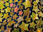 Load image into Gallery viewer, Gold hologram Iridescent sequin Stars On Black Stretch Velvet Fabric Sold By The Yard
