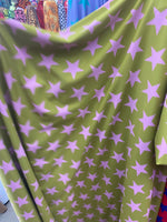Load image into Gallery viewer, Pink stars on green Spandex trixot 4 way stretch fabric 58" wide
