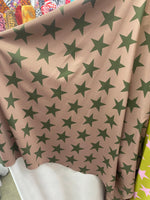 Load image into Gallery viewer, Green stars on camel Spandex trixot 4 way stretch fabric 58" wide
