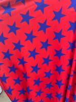 Load image into Gallery viewer, Blue stars on red Spandex trixot 4 way stretch fabric 58" wide
