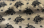 Load image into Gallery viewer, Organza Black floral flocking on dark gold sparkling  fabric 45” wide
