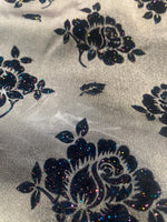 Load image into Gallery viewer, Organza Black floral flocking on dark gold sparkling  fabric 45” wide
