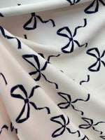 Load image into Gallery viewer, Black bows on white spandex 4  way  fabric by the yard
