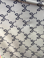 Load image into Gallery viewer, Black bows on white spandex 4  way  fabric by the yard
