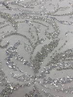Load image into Gallery viewer, White beaded swirl wedding sequins and pearls on mesh white fabric, 54 inches wide
