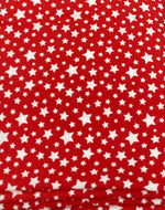 Load image into Gallery viewer, White stars all over on red Poly cotton fabric sold by yard  58" wide
