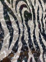 Load image into Gallery viewer, Zebra black and white stretch lace with sequins all around 58” wide
