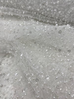 Load image into Gallery viewer, Ivory pearls sequins on mesh fabric, 54 inches wide
