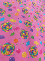 Load image into Gallery viewer, Candy Land Spandex Fabric – Pink Background with Colorful Lollipops &amp; Sweets – Stretch Fabric by the Yard
