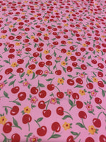 Load image into Gallery viewer, Spandex cherry on dark pink swimsuit clothing fabric per yard 60" wide

