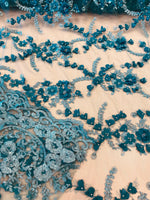 Load image into Gallery viewer, Turquoise Blue 3D Floral Embroidered Lace Fabric – Beaded Mesh Lace for Dresses, Gowns, and Special Occasion Sewing
