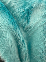 Load image into Gallery viewer, Faux fur, Aqua shaggy fabric per yard 60 inches wide
