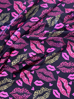 Load image into Gallery viewer, Wild Kiss Leopard Lips Satin Spandex Fabric – Pink &amp; Gold Lip Print on Black Stretch Fabric – Rave, Bodysuit, Dancewear, Leggings Material
