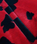 Load image into Gallery viewer, Cow Animal print Velboa Black on Red Spots Fabric BY THE YARD 60" Wide
